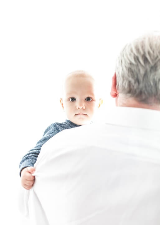 Grandad holding baby