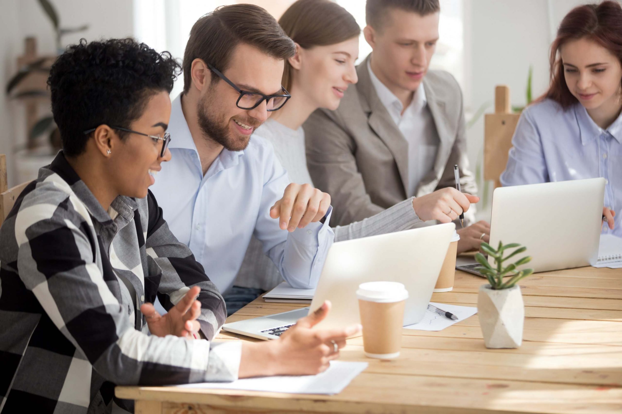 Team members gathered around a table