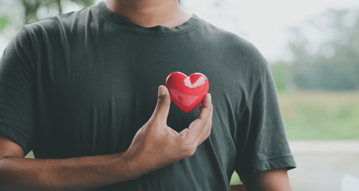 Planning for a successful and happy 2024.Man holding red heart.